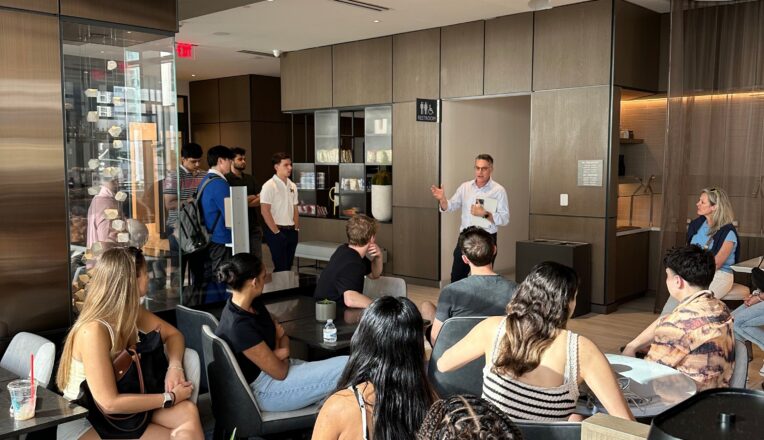 Bobby Finvarb speaking to students during the speaker series